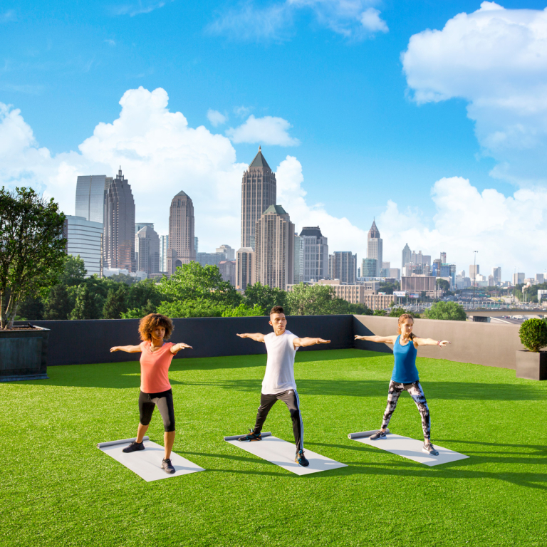 students practicing yoga outside