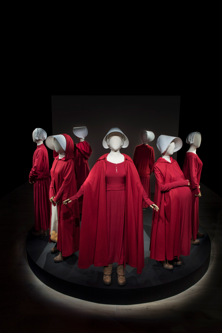 Red costumes from exhibition "Dressing for Dystopia"